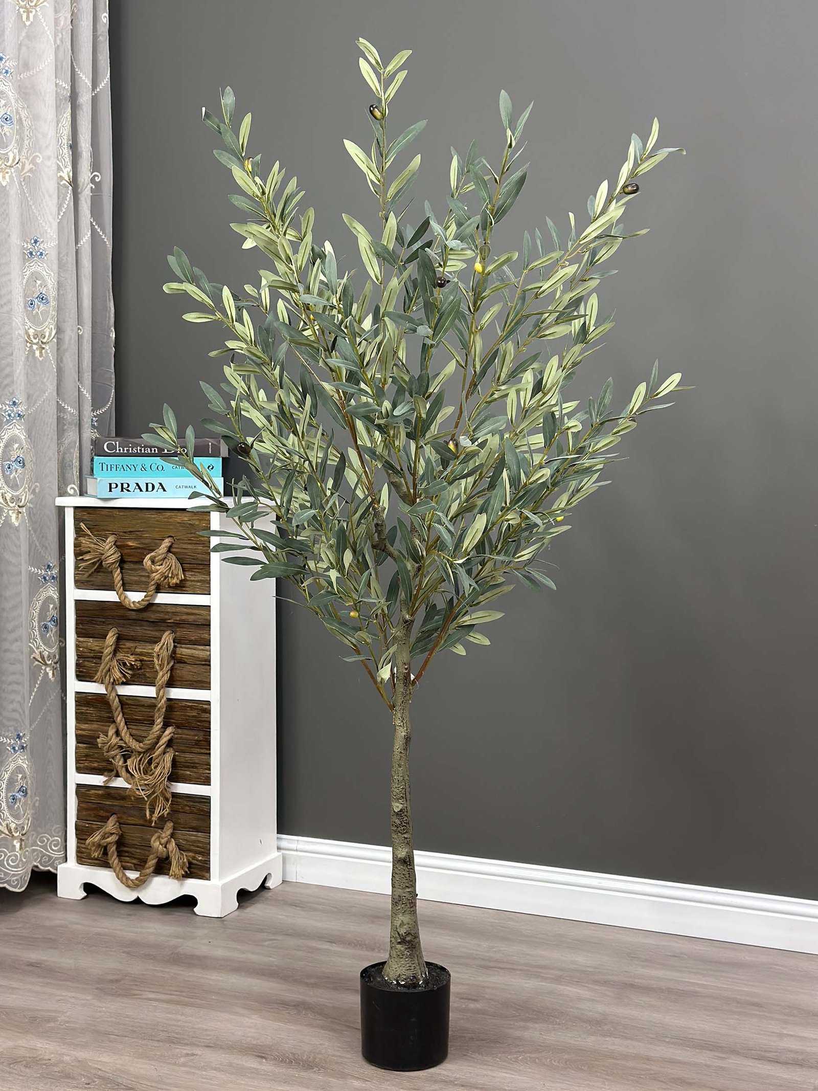 Elevate your interior with our gorgeous Artificial Olive Tree. Enjoy the charm of nature in your home or workspace all year round!