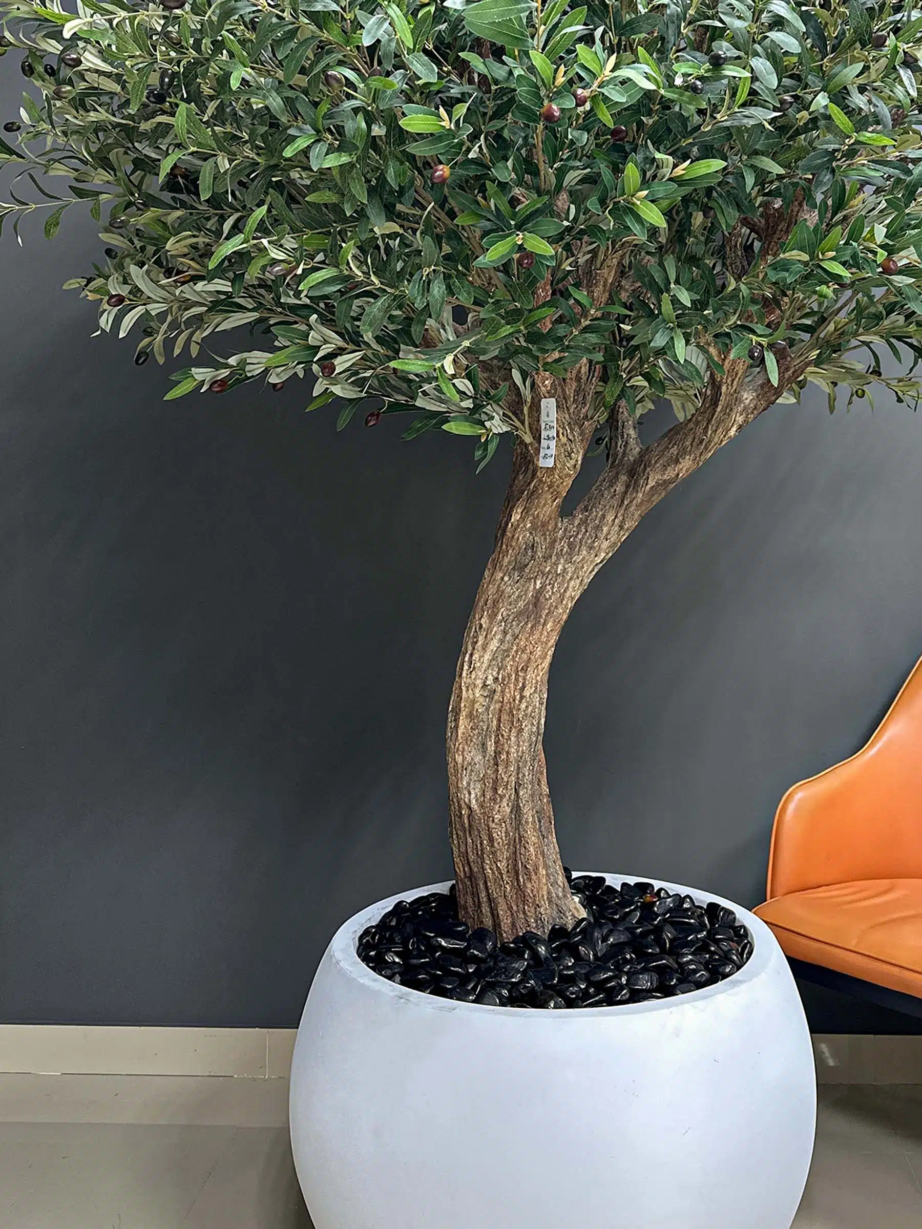 Elevate your interior with our gorgeous Artificial Olive Tree. Enjoy the charm of nature in your home or workspace all year round!