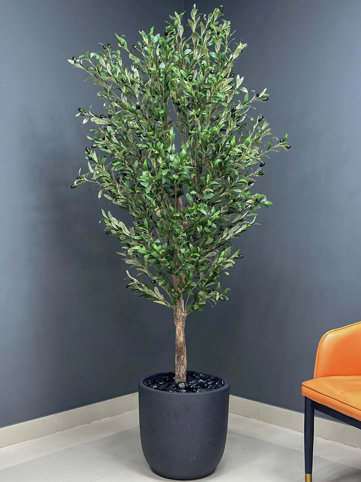 9132(1) Elevate your interior with our gorgeous Artificial Olive Tree. Enjoy the charm of nature in your home or workspace all year round!