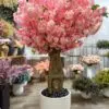 9159(1) Transform your space with the stunning Artificial Pink Cherry Blossom Tree. Bring nature indoors effortlessly and enjoy everlasting beauty!