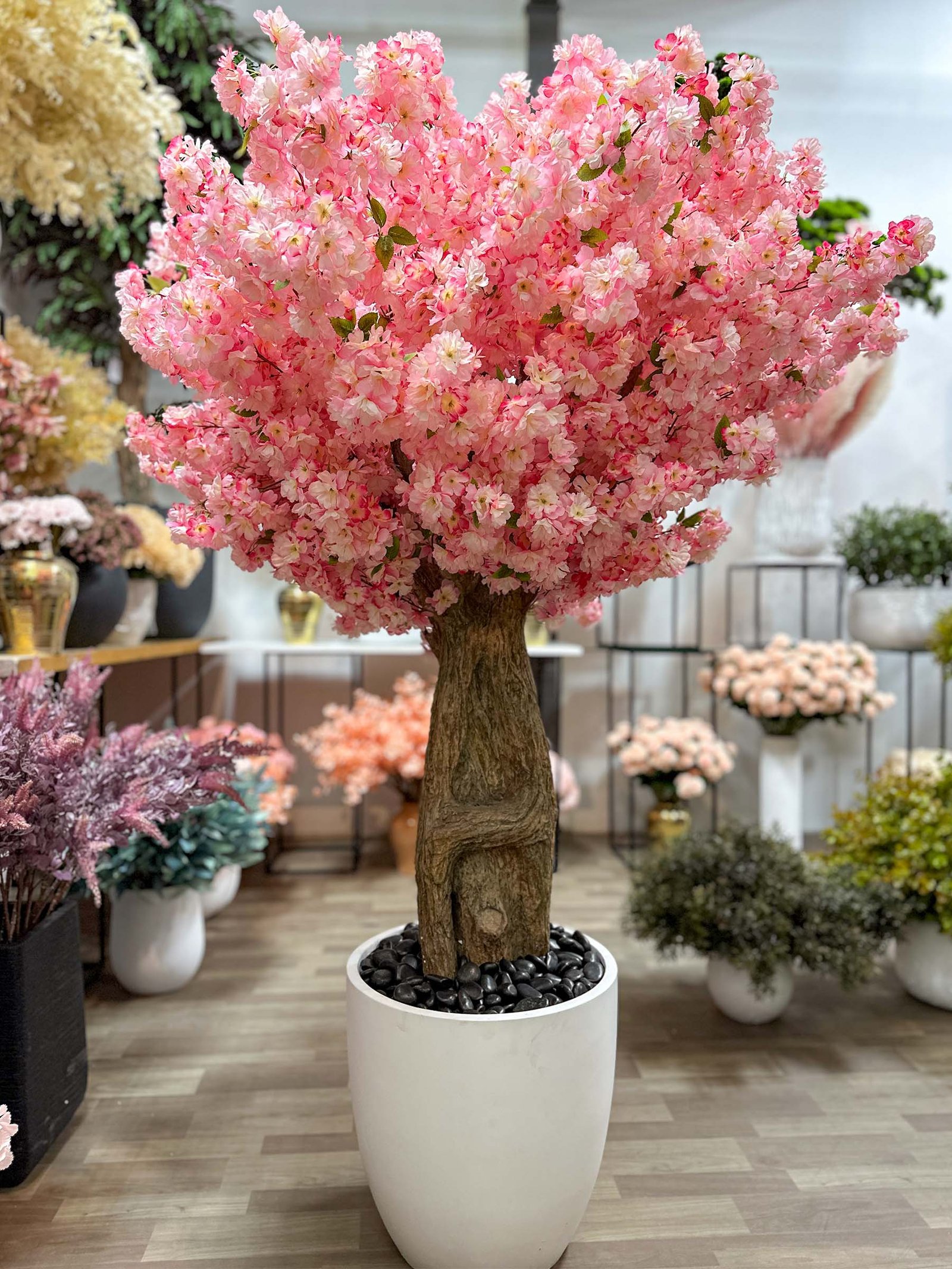 Transform your space with the stunning Artificial Pink Cherry Blossom Tree. Bring nature indoors effortlessly and enjoy everlasting beauty!