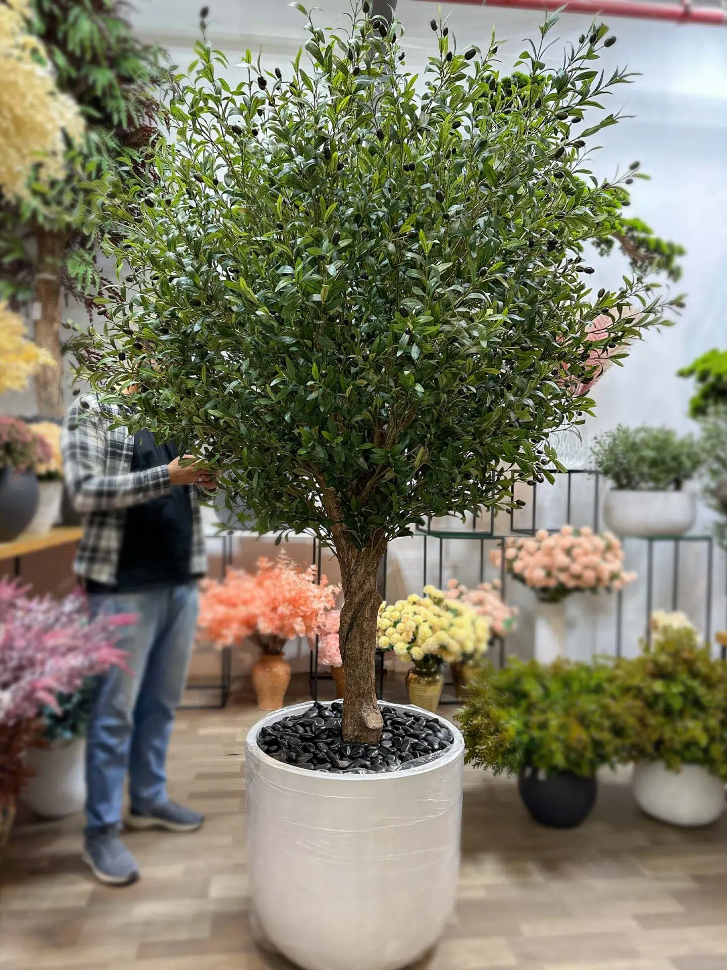 Elevate your interior with our gorgeous Artificial Olive Tree. Enjoy the charm of nature in your home or workspace all year round!