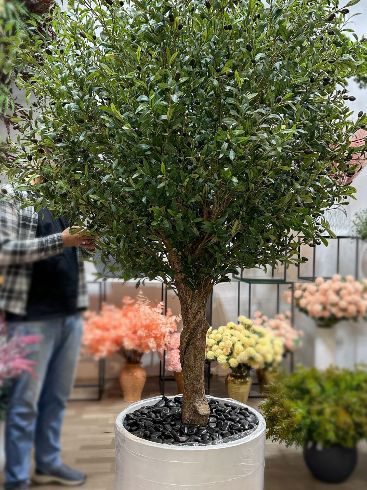 Elevate your interior with our gorgeous Artificial Olive Tree. Enjoy the charm of nature in your home or workspace all year round!