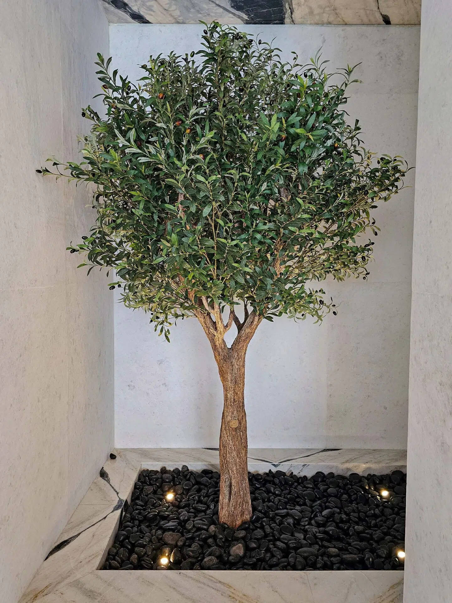 Elevate your interior with our gorgeous Artificial Olive Tree. Enjoy the charm of nature in your home or workspace all year round!