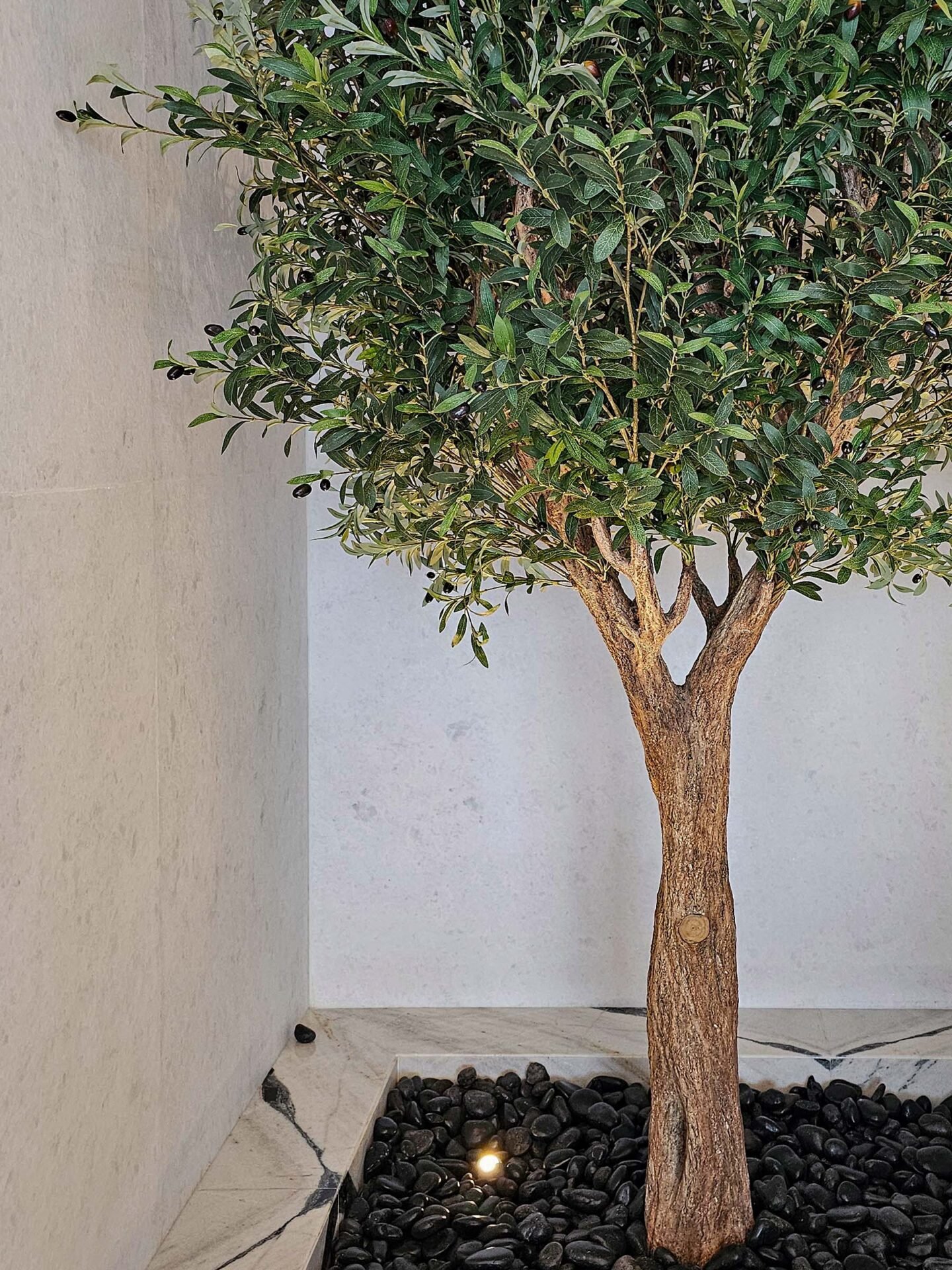Elevate your interior with our gorgeous Artificial Olive Tree. Enjoy the charm of nature in your home or workspace all year round!