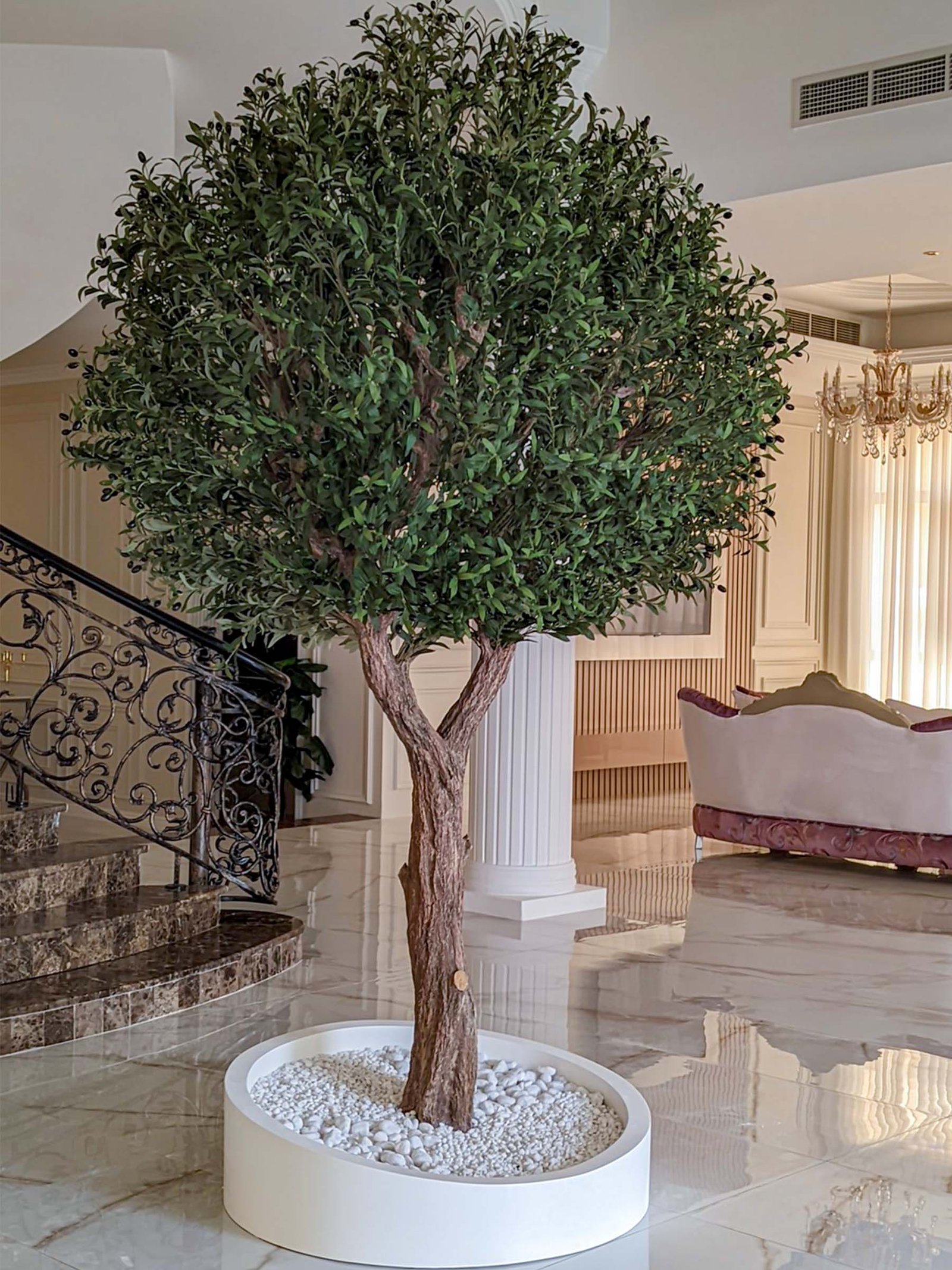 Elevate your interior with our gorgeous Artificial Olive Tree. Enjoy the charm of nature in your home or workspace all year round!