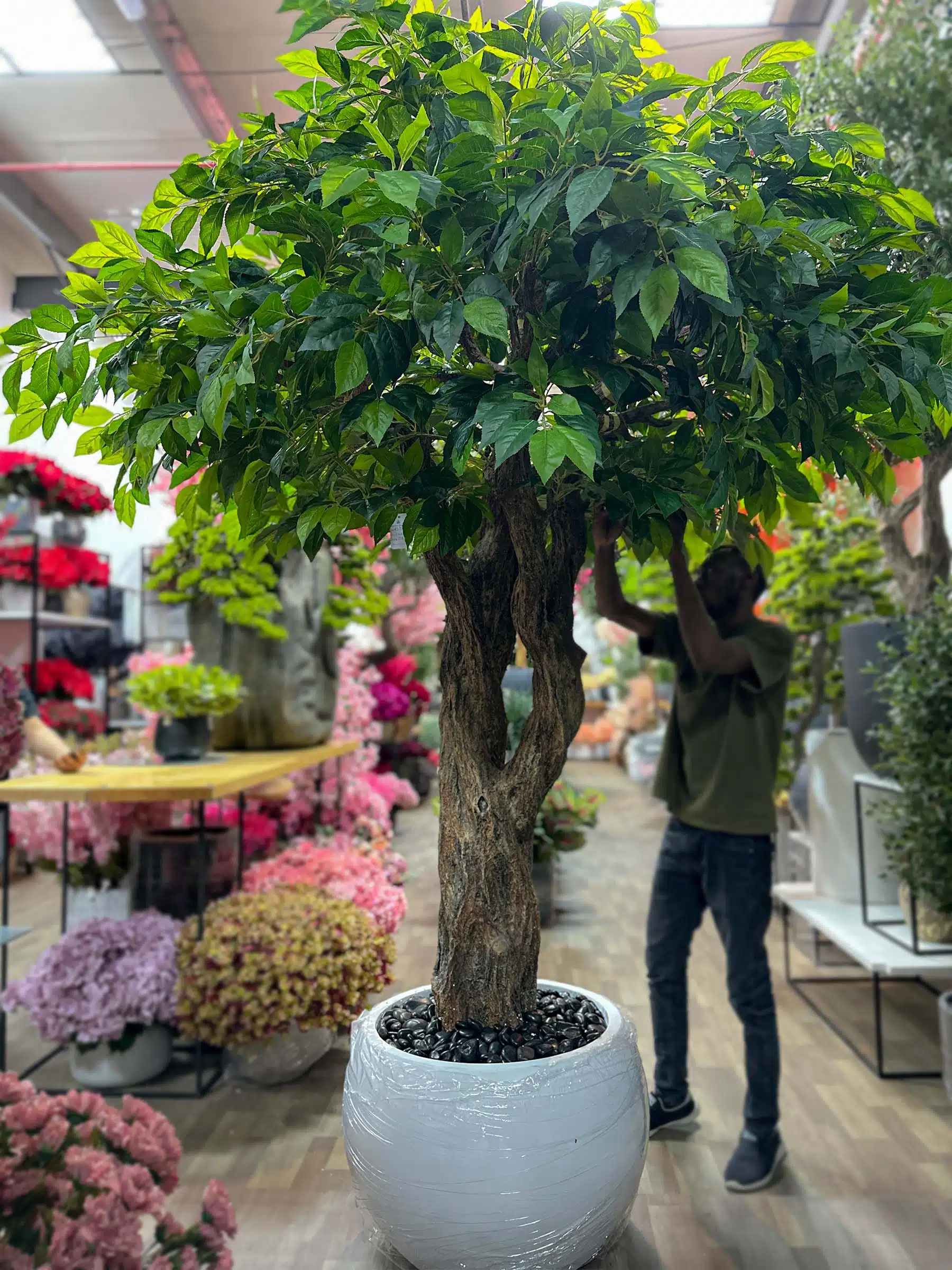 Elevate any room with our realistic Artificial Greenery Tree, providing a maintenance-free touch of nature. Experience the difference in your space!