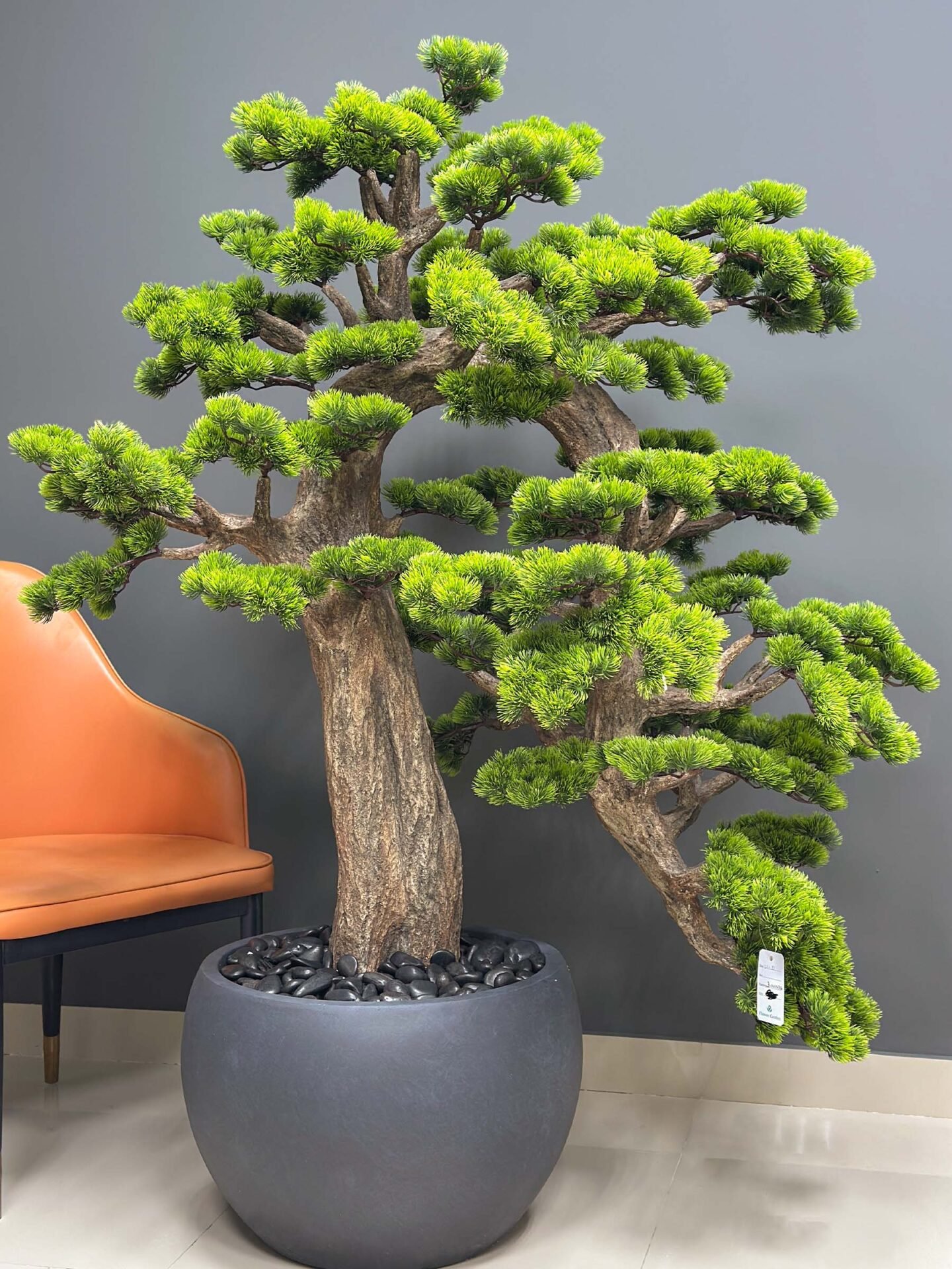 Elevate your space with this stunning Artificial Bonsai Tree! Its realistic design and stylish pot will bring everlasting beauty to any setting.