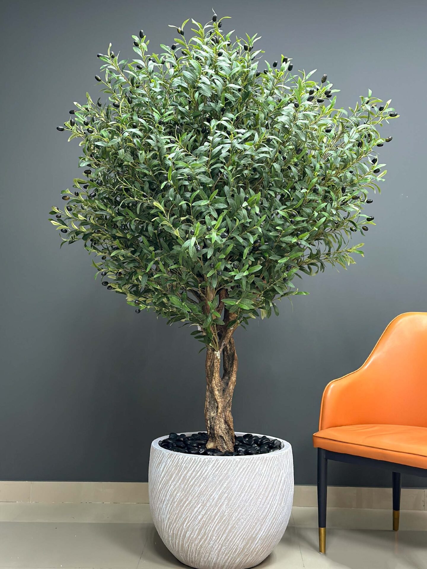 Elevate your interior with our gorgeous Artificial Olive Tree. Enjoy the charm of nature in your home or workspace all year round!
