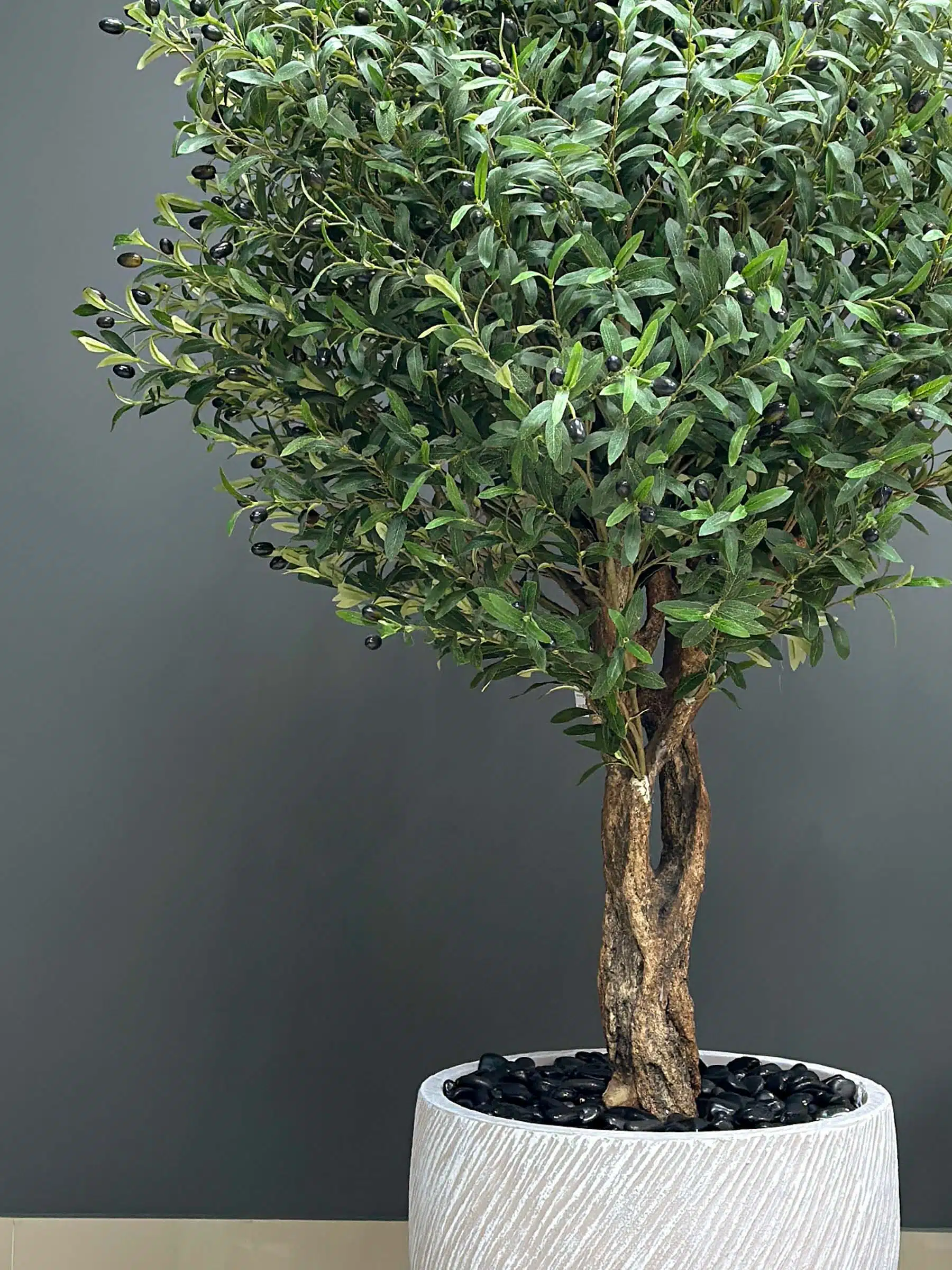 Elevate your interior with our gorgeous Artificial Olive Tree. Enjoy the charm of nature in your home or workspace all year round!