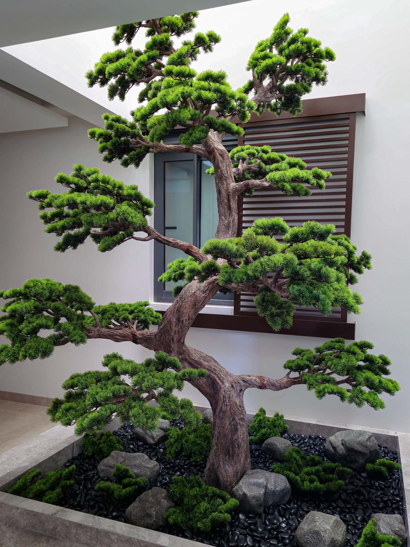 Elevate your space with this stunning Artificial Bonsai Tree! Its realistic design and stylish pot will bring everlasting beauty to any setting.
