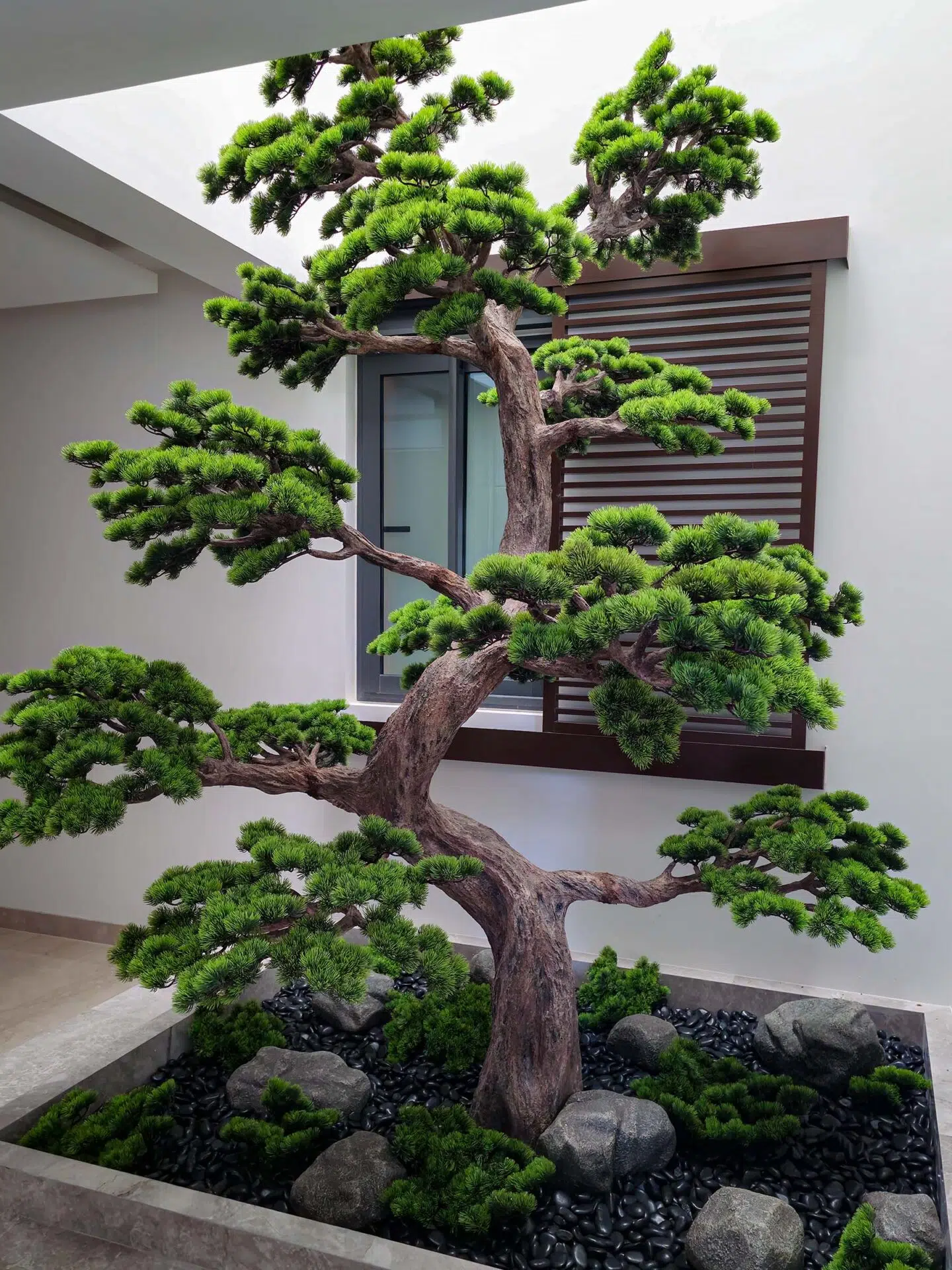 Elevate your space with this stunning Artificial Bonsai Tree! Its realistic design and stylish pot will bring everlasting beauty to any setting.