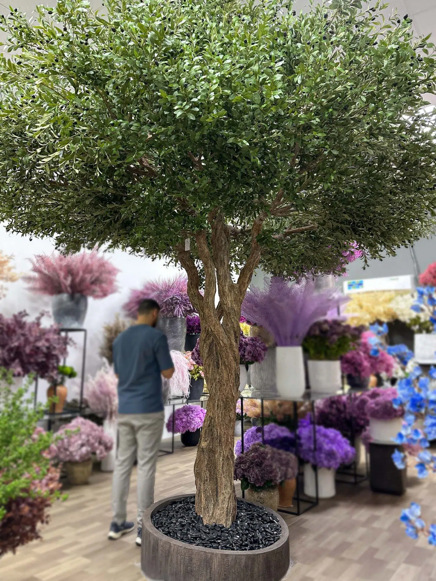 Elevate your interior with our gorgeous Artificial Olive Tree. Enjoy the charm of nature in your home or workspace all year round!