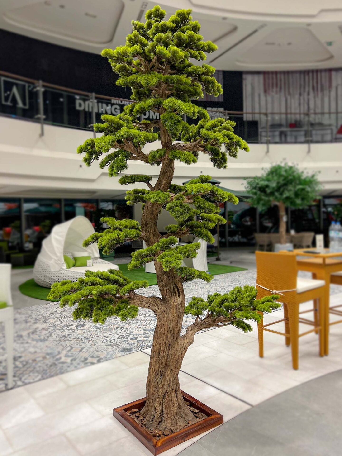 Elevate your space with this stunning Artificial Bonsai Tree! Its realistic design and stylish pot will bring everlasting beauty to any setting.