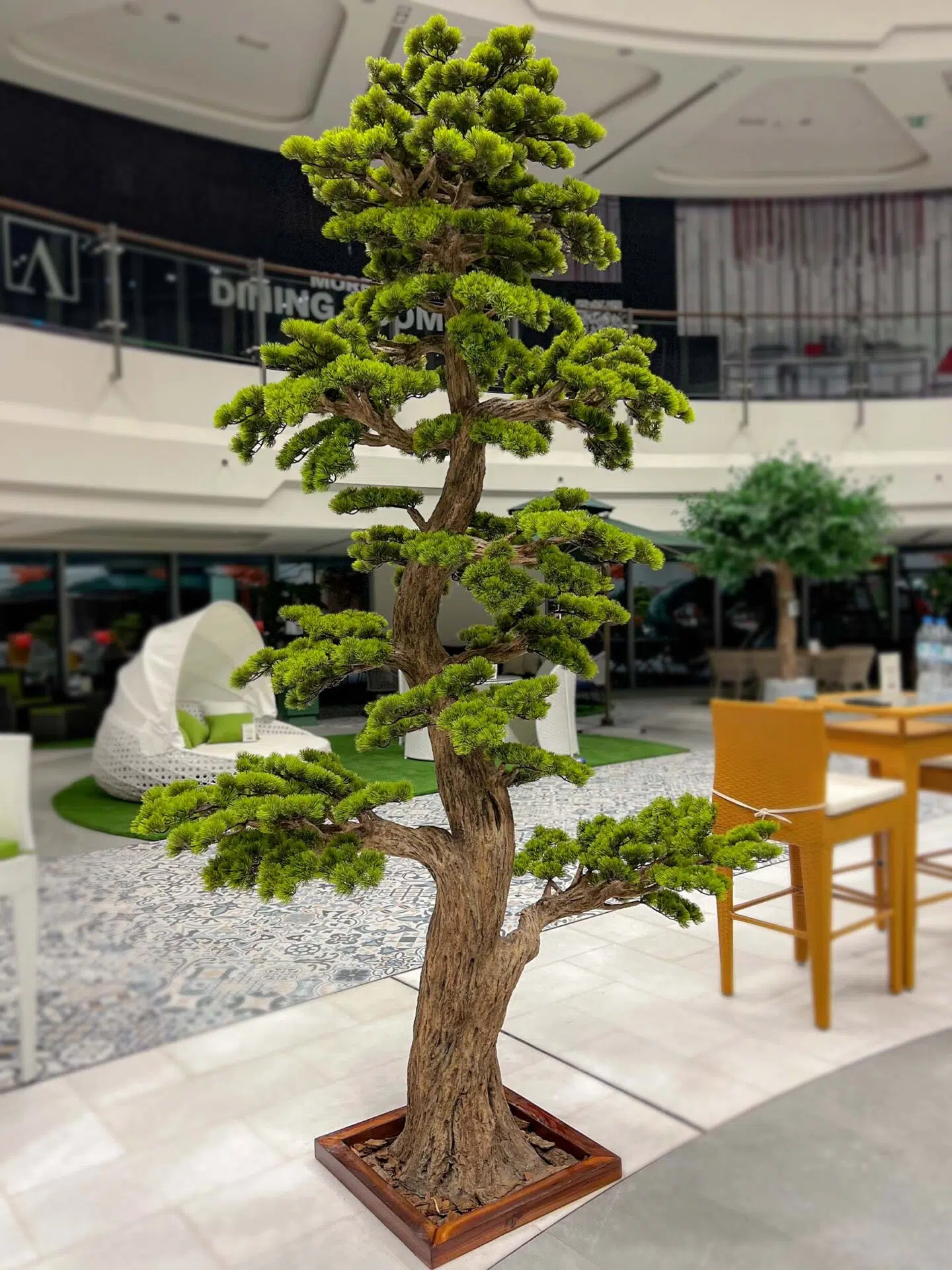 Elevate your space with this stunning Artificial Bonsai Tree! Its realistic design and stylish pot will bring everlasting beauty to any setting.
