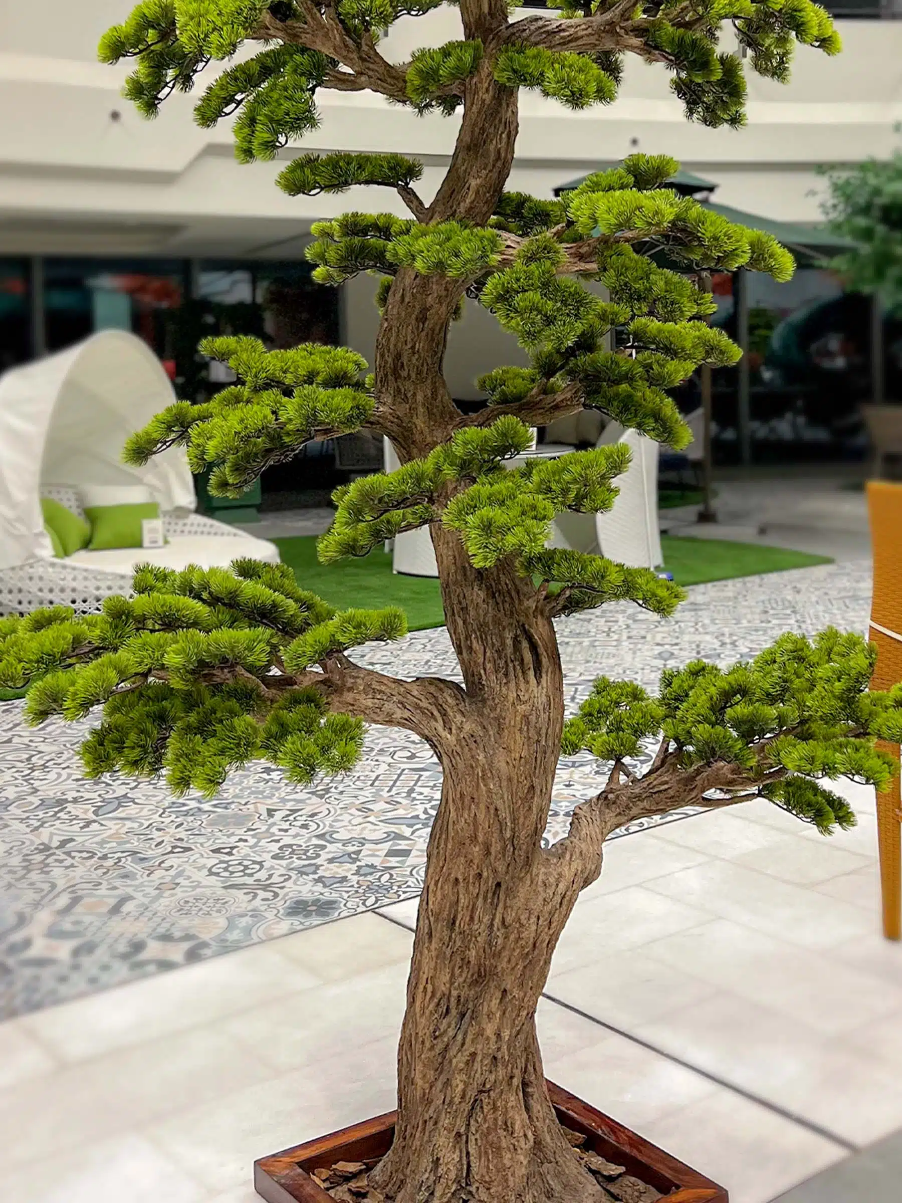 Elevate your space with this stunning Artificial Bonsai Tree! Its realistic design and stylish pot will bring everlasting beauty to any setting.
