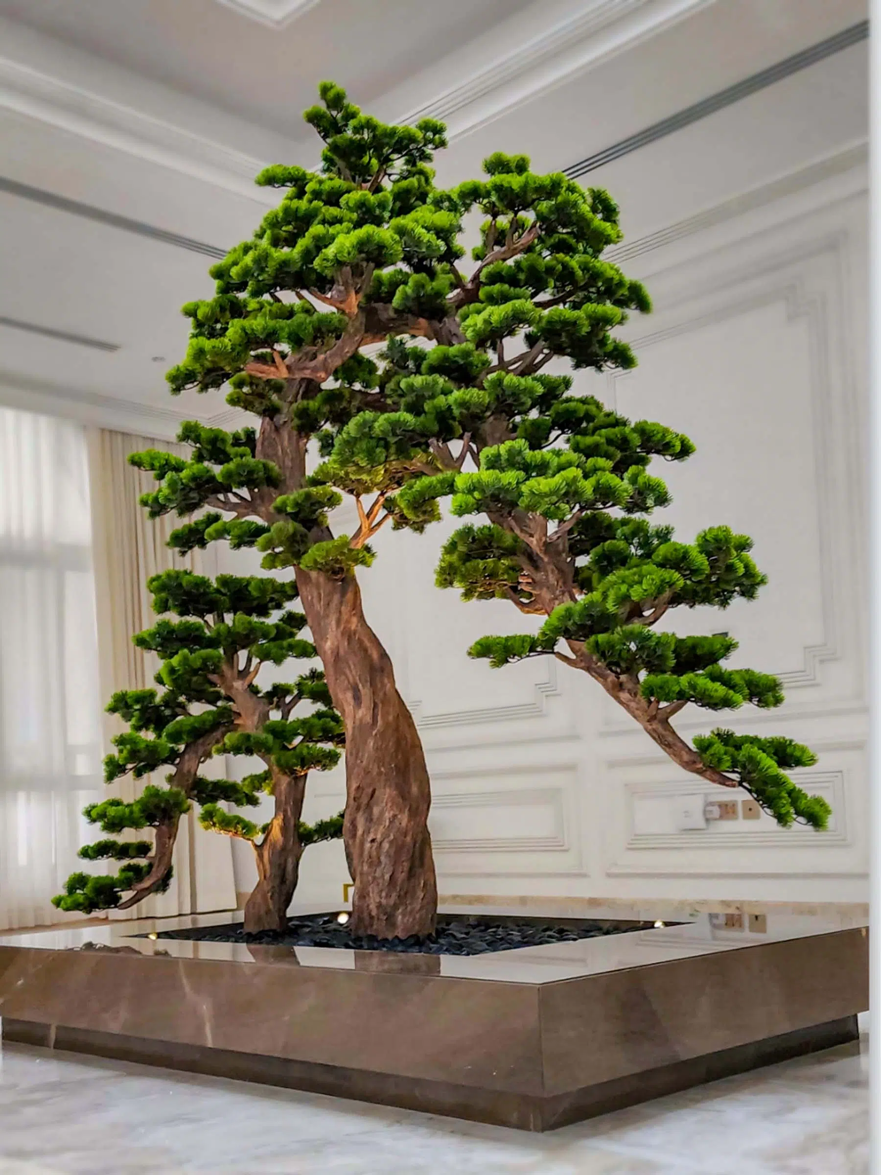Elevate your space with this stunning Artificial Bonsai Tree! Its realistic design and stylish pot will bring everlasting beauty to any setting.