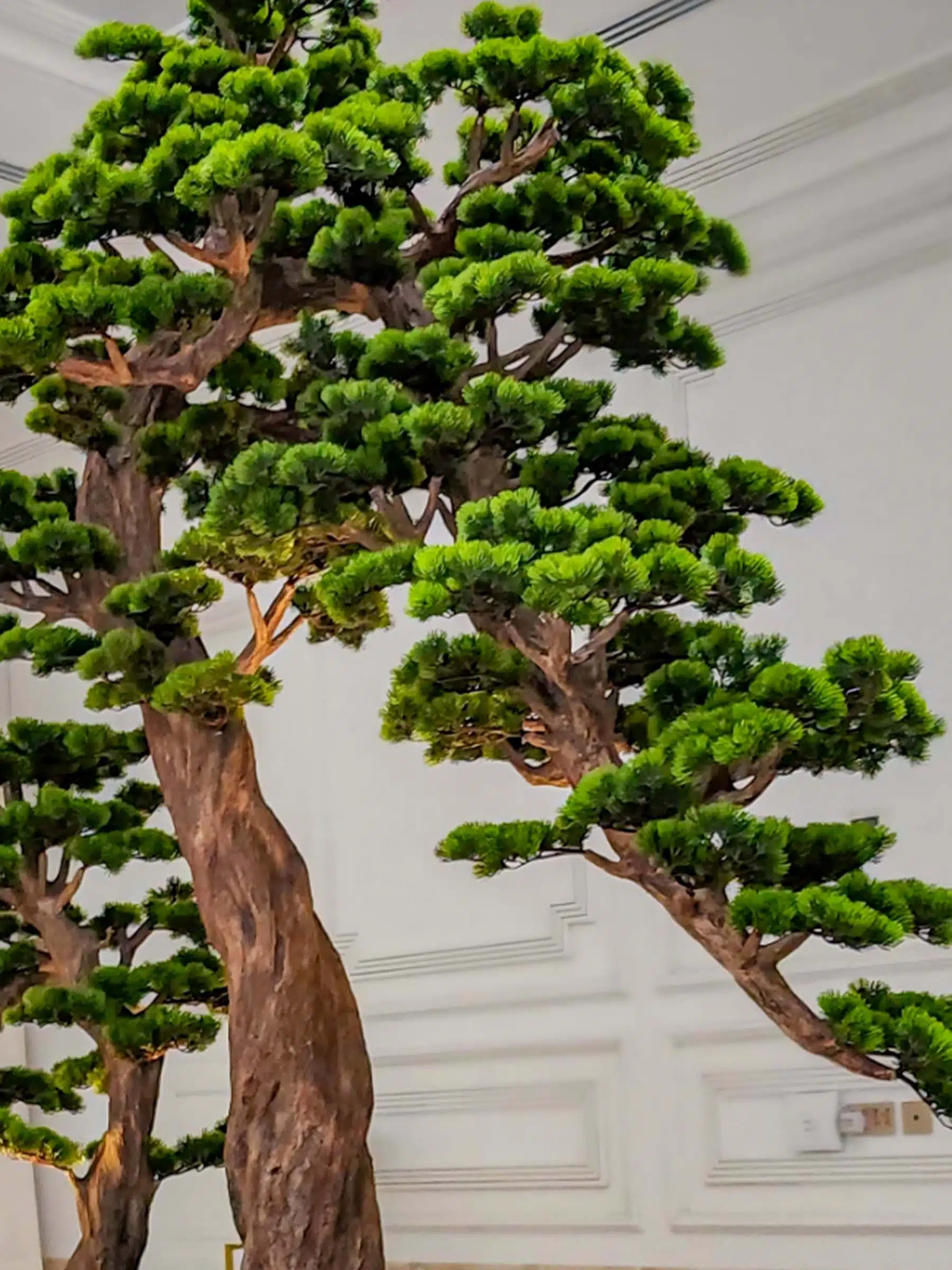 Elevate your space with this stunning Artificial Bonsai Tree! Its realistic design and stylish pot will bring everlasting beauty to any setting.