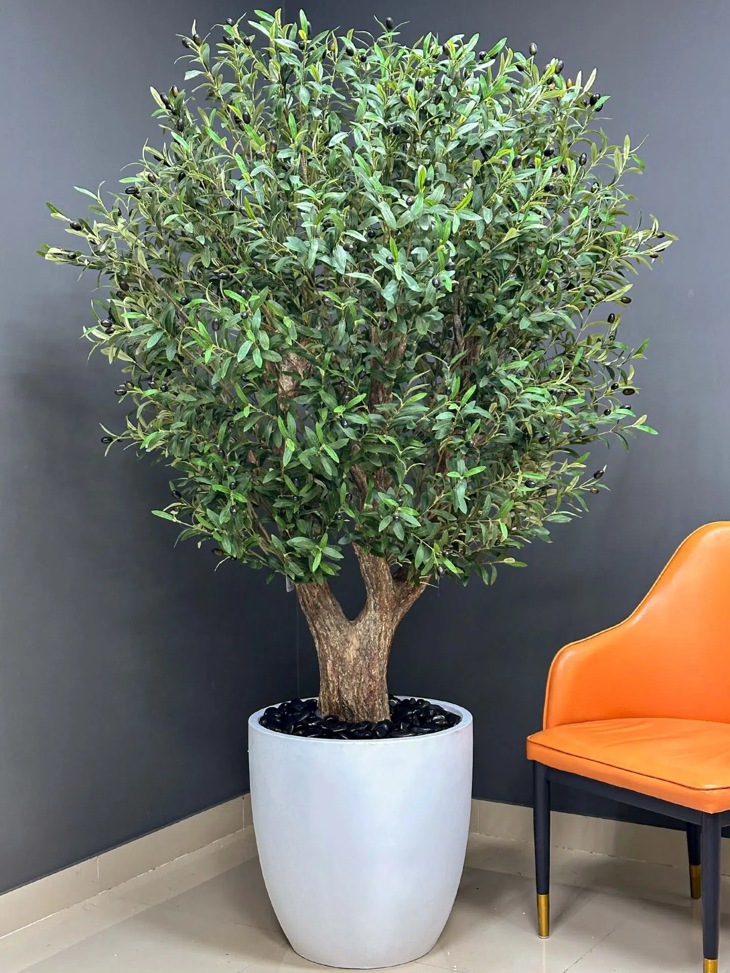 Elevate your interior with our gorgeous Artificial Olive Tree. Enjoy the charm of nature in your home or workspace all year round!