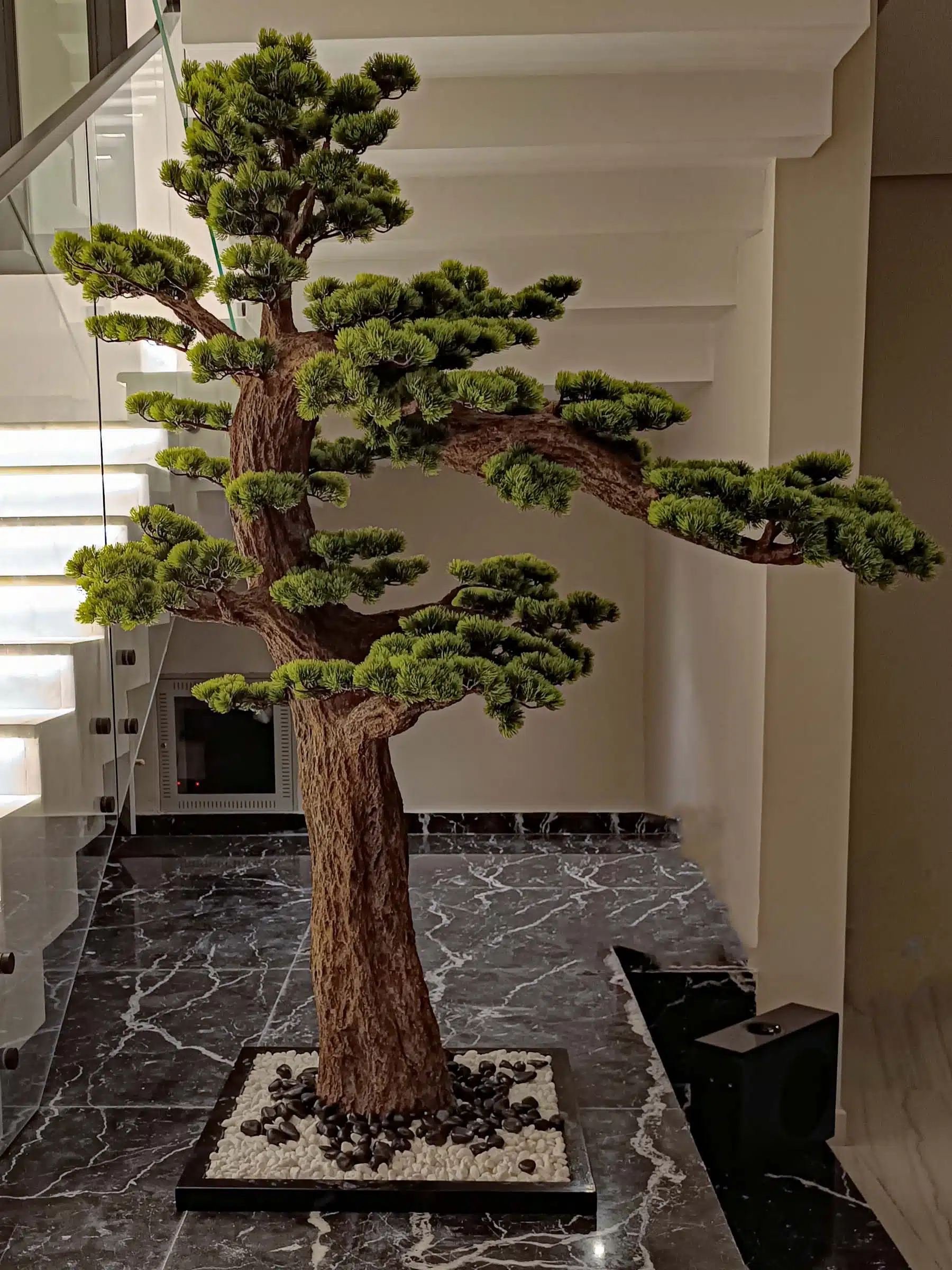 Elevate your space with this stunning Artificial Bonsai Tree! Its realistic design and stylish pot will bring everlasting beauty to any setting.