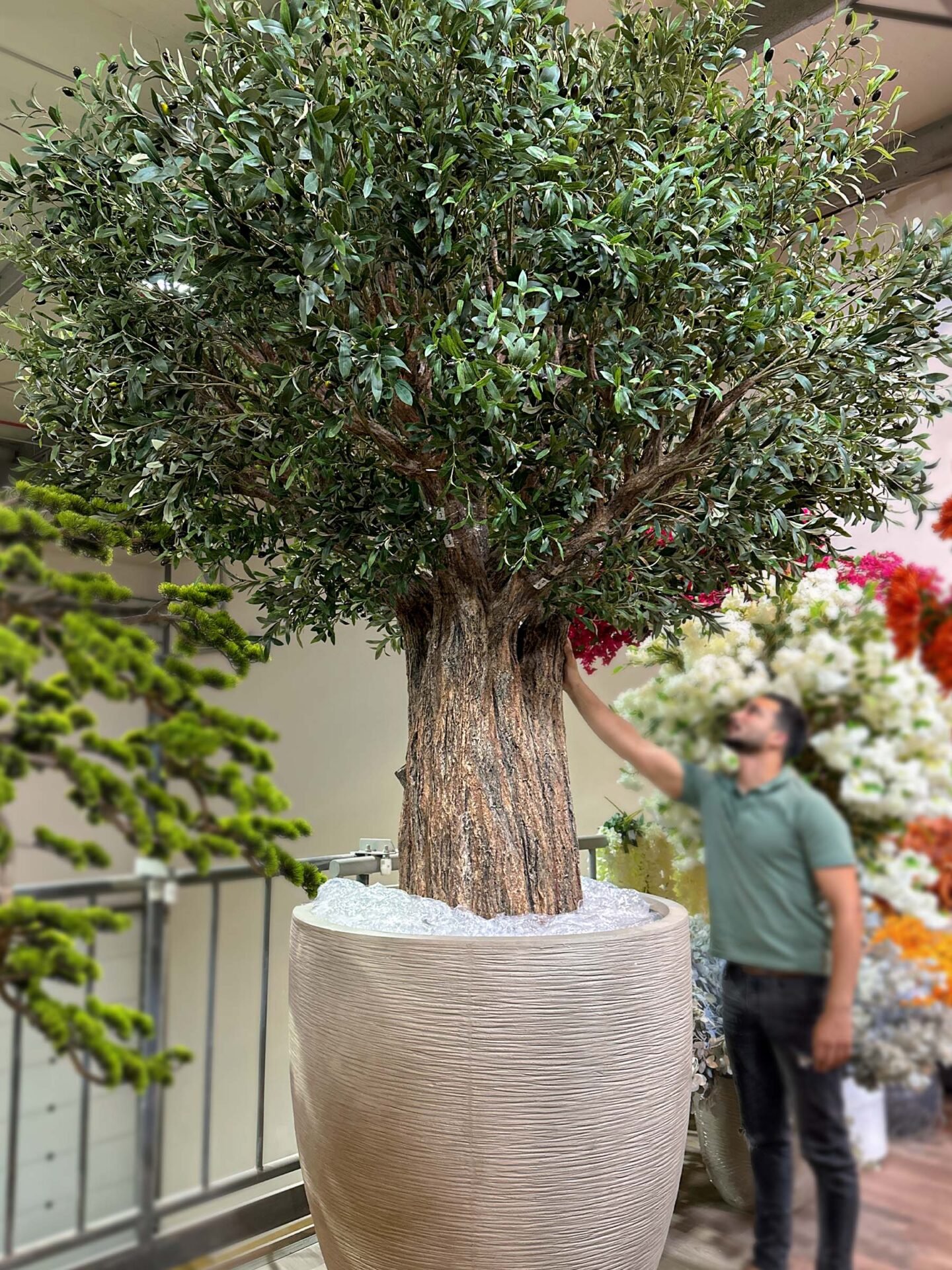 Looking for lasting beauty? The Artificial Olive Tree adds flair to any environment, whether commercial or residential. Create your oasis today!