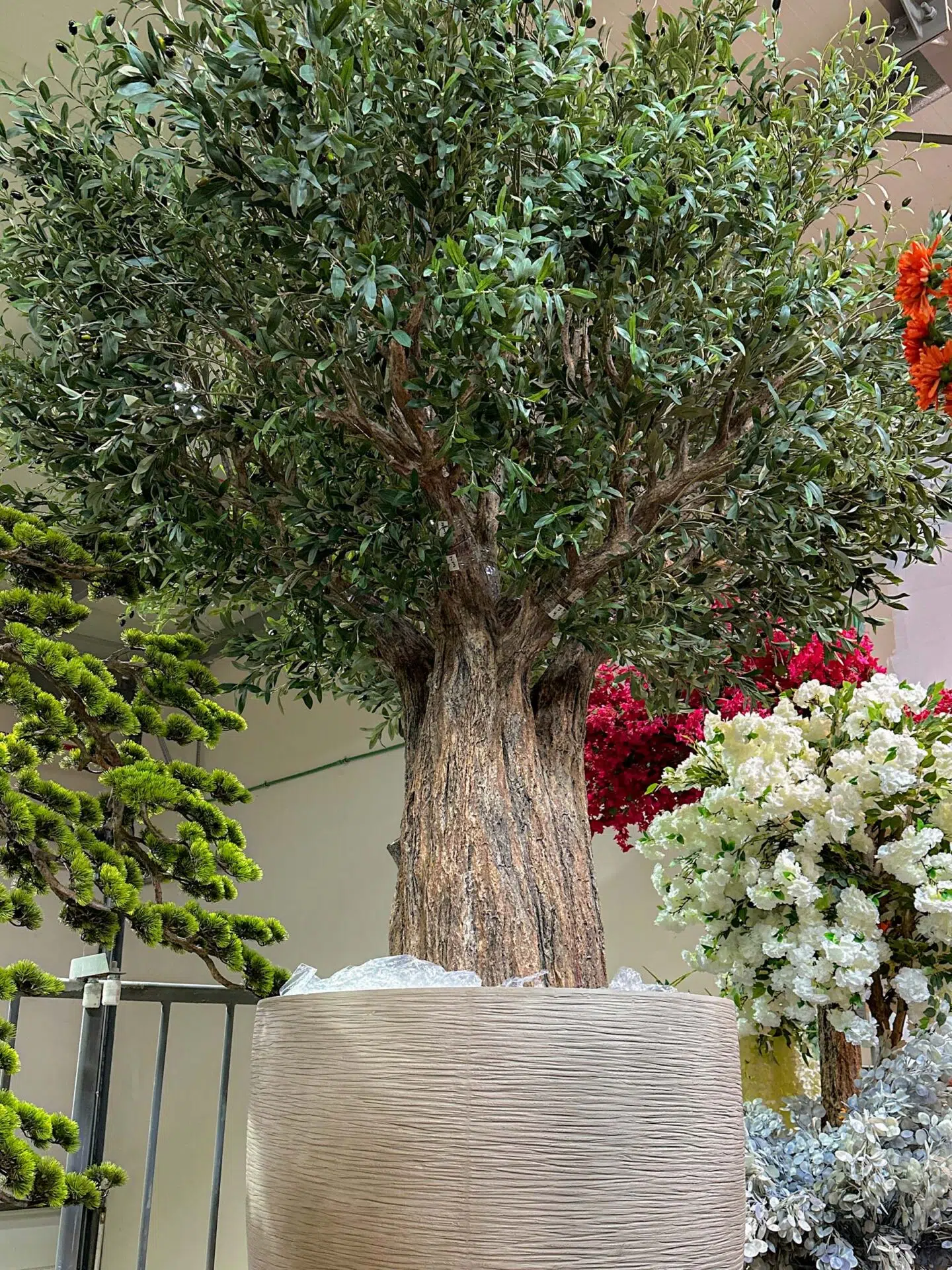 9717(2) Looking for lasting beauty? The Artificial Olive Tree adds flair to any environment, whether commercial or residential. Create your oasis today!