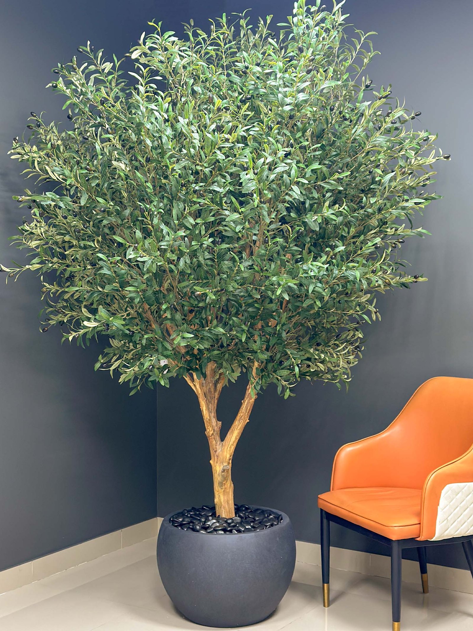 Elevate your interior with our gorgeous Artificial Olive Tree. Enjoy the charm of nature in your home or workspace all year round!