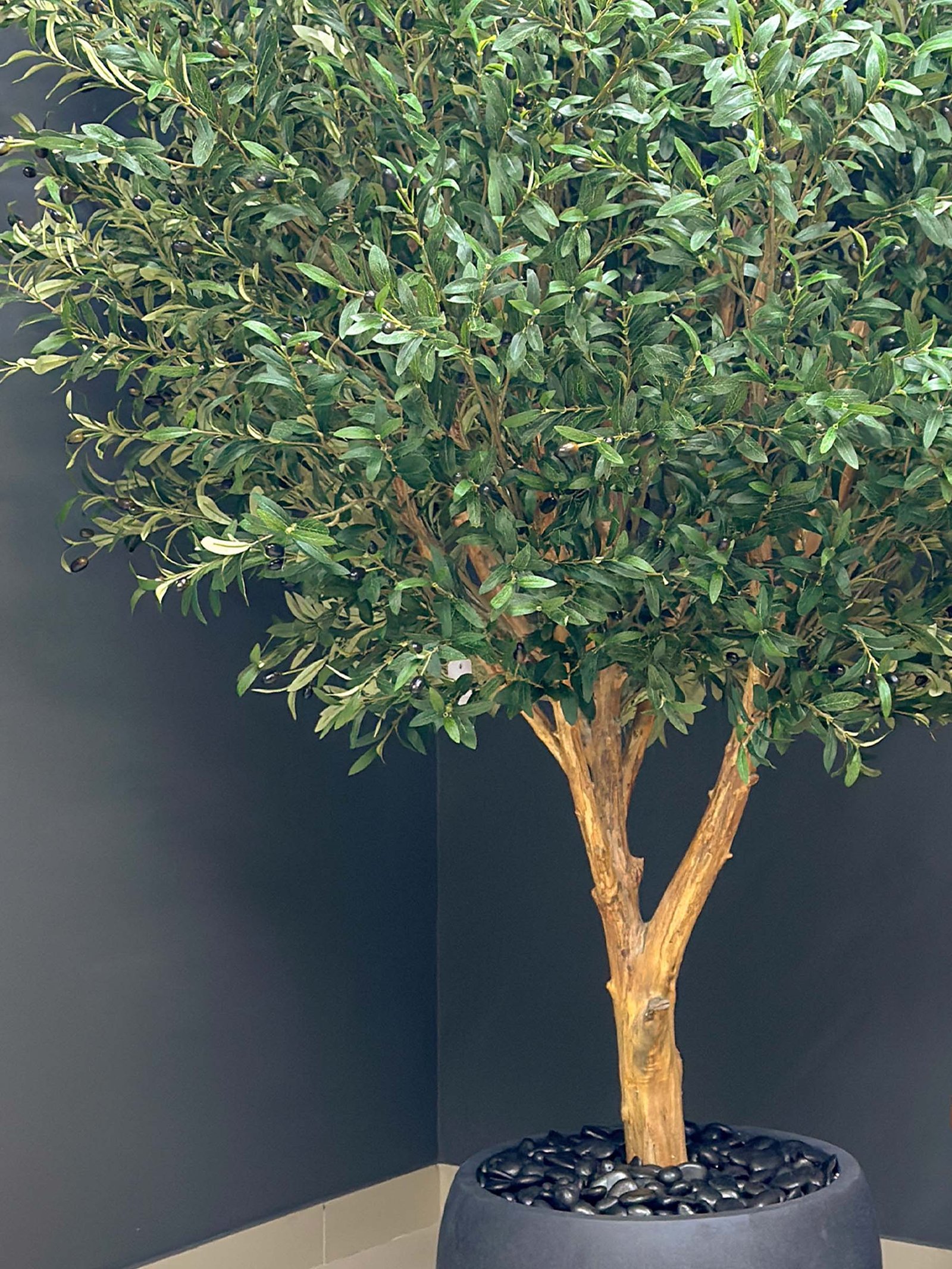 Elevate your interior with our gorgeous Artificial Olive Tree. Enjoy the charm of nature in your home or workspace all year round!