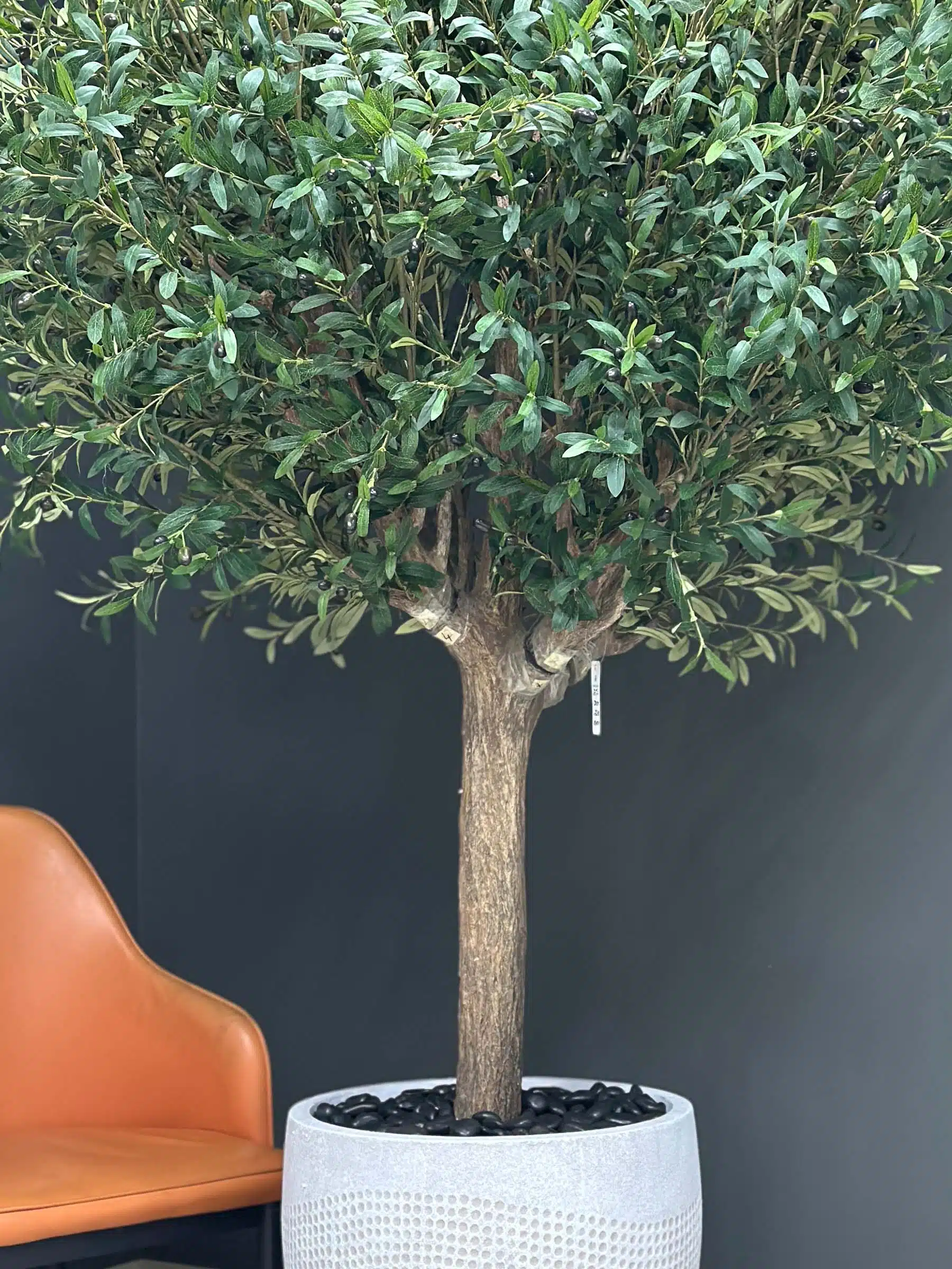 Elevate your interior with our gorgeous Artificial Olive Tree. Enjoy the charm of nature in your home or workspace all year round!
