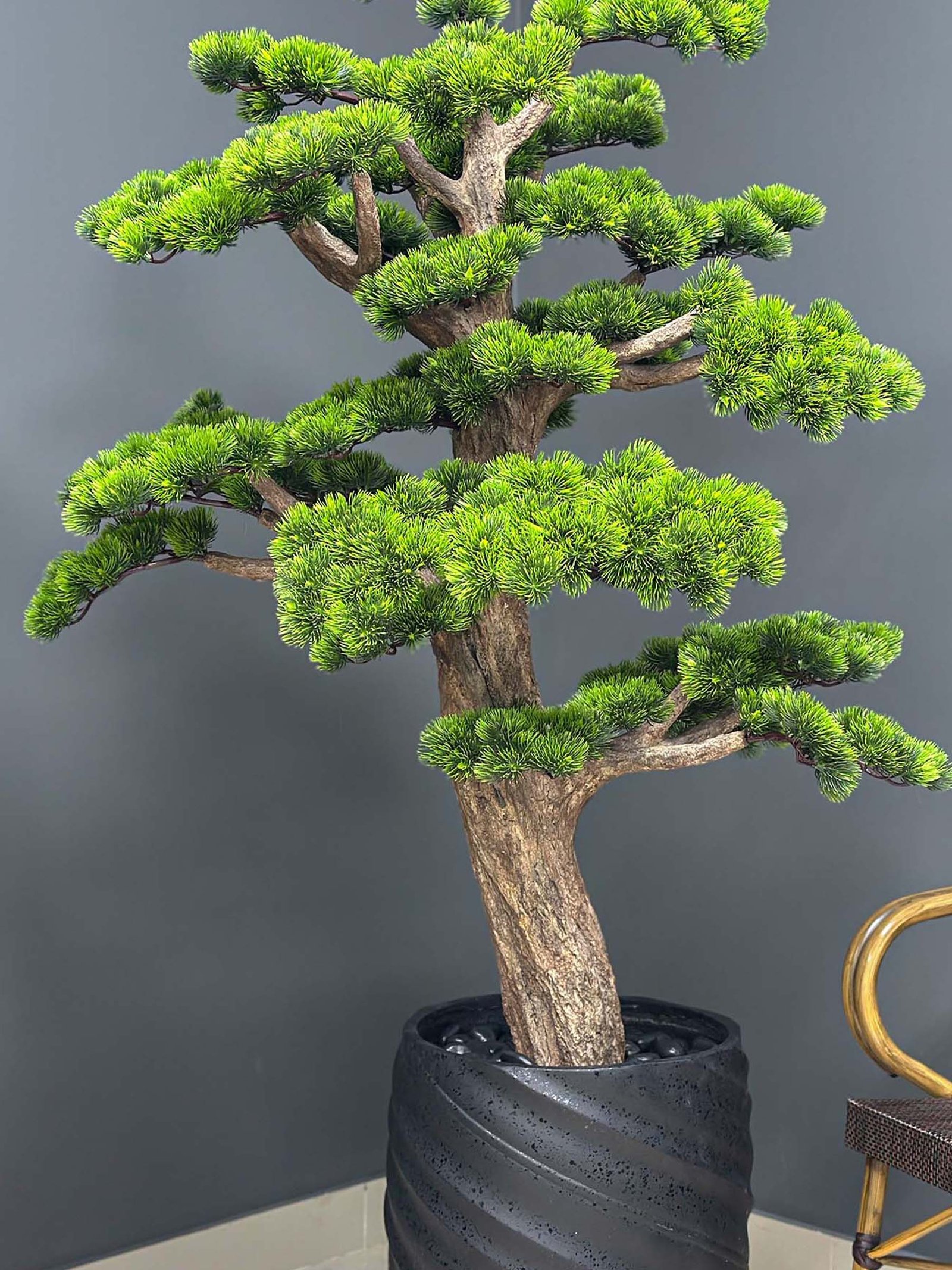 Elevate your space with this stunning Artificial Bonsai Tree! Its realistic design and stylish pot will bring everlasting beauty to any setting.
