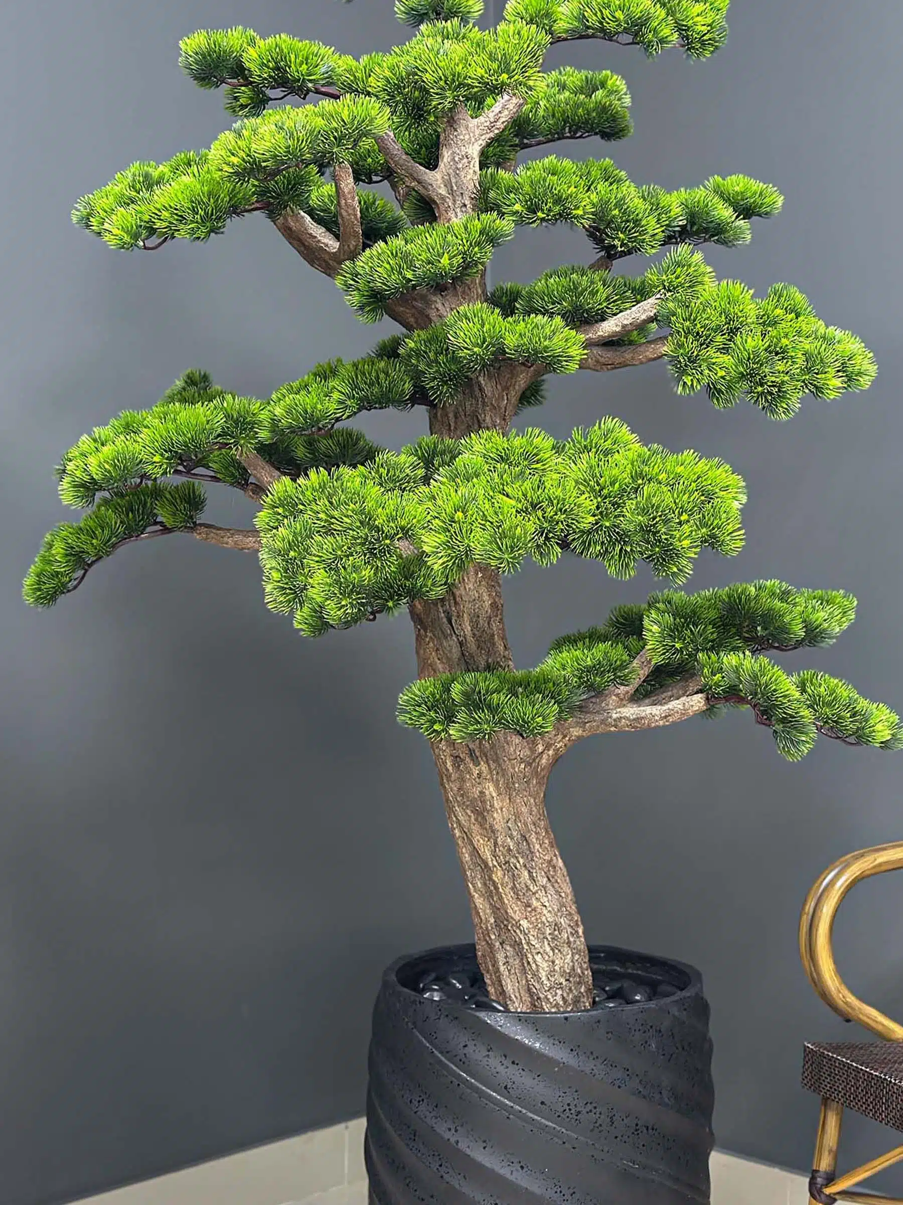 Elevate your space with this stunning Artificial Bonsai Tree! Its realistic design and stylish pot will bring everlasting beauty to any setting.