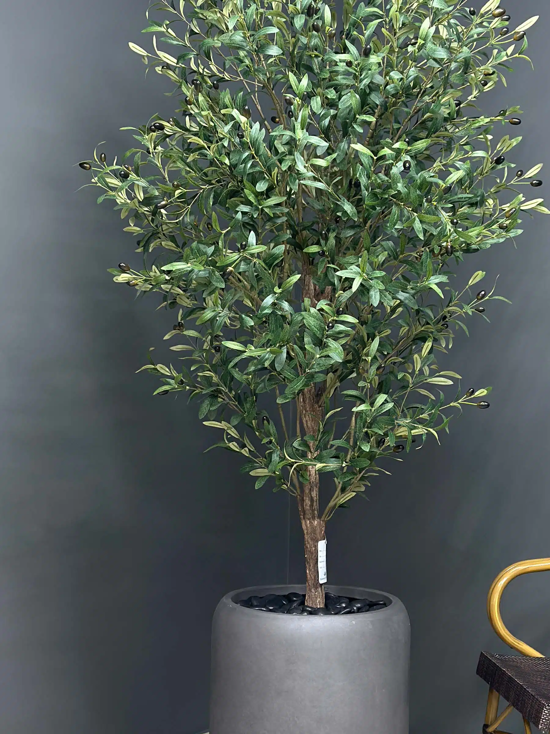 Elevate your interior with our gorgeous Artificial Olive Tree. Enjoy the charm of nature in your home or workspace all year round!