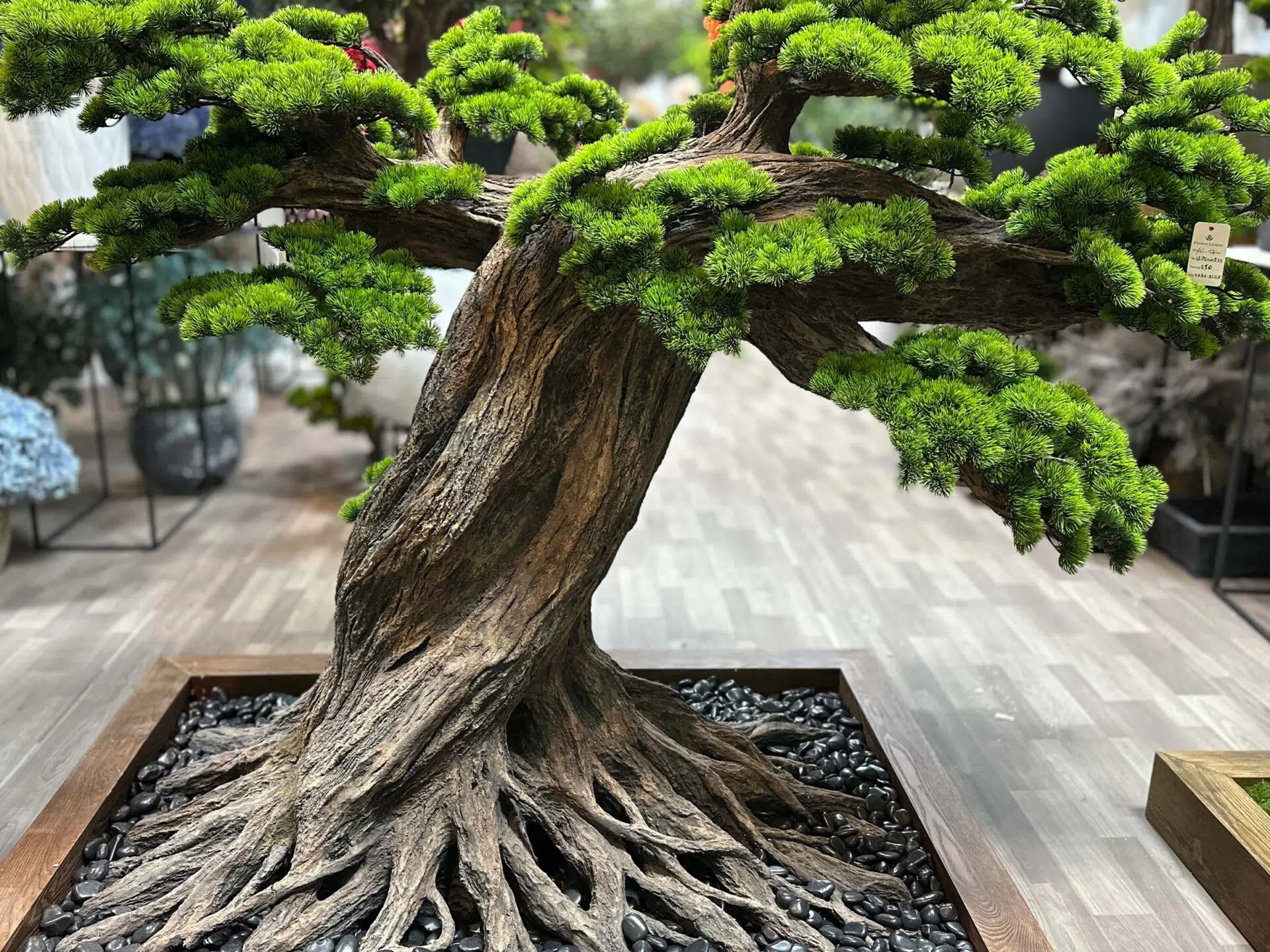 Elevate your space with this stunning Artificial Bonsai Tree! Its realistic design and stylish pot will bring everlasting beauty to any setting.